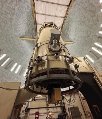 IGRINS installed on the Harlan J. Smith Telescope at McDonald Observatory. It is the yellow box mounted to the base of the telescope. Photo courtesy of Erica Sawczynec, McDonald Observatory.