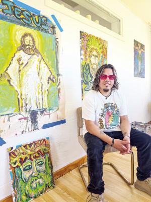 Artist Jeremy Gonzalez poses in his Fort Stockton studio with several pieces from “The Jesus Show,” his upcoming two-day exhibition at Rü Coffee Shop on Aug. 7-8.
