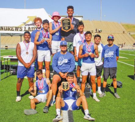 The Panthers track team poses atop the podium at Andrews High School after winning an area championship. Photo by Nathan Heuer