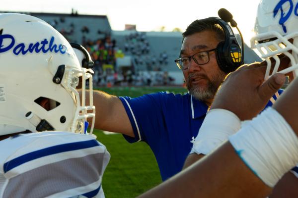 Coach Rojas instructs Fort Stockton players on the sideline during the Panthers’ 35–28 loss to Ysleta Friday in El Paso. Photo by Zachary Gray | Tumbleweed+