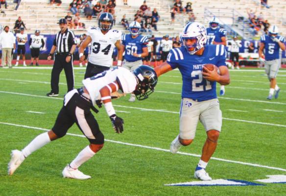 Fort Stockton’s Dominic Aguilar stiff arms a Horizon opponent during the Panthers 40-34 win on Sept. 10. Photo by Nathan Heuer
