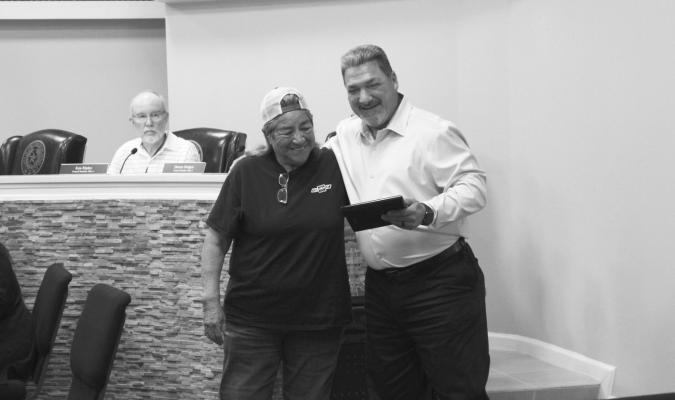 HONORING SERVICE — City Manager Frank Rodriguez and Eva S. Nanez pose for a photograph following a recognition ceremony during the Fort Stockton City Council meeting on Monday, April 27. Nanez was presented with a plaque for nearly 18 years of “exceptional commitment and distinguished service” to the citizens of Fort Stockton for her work from March 2008 through March 2026. Photo by Joh Covington