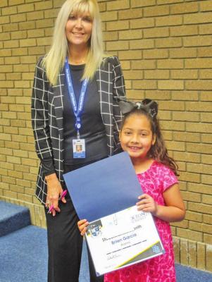 Brilen Garcia was selected as the Alamo Student of the Month. Assistant Superintendent Adrienne Horton presented Garcia with the award.