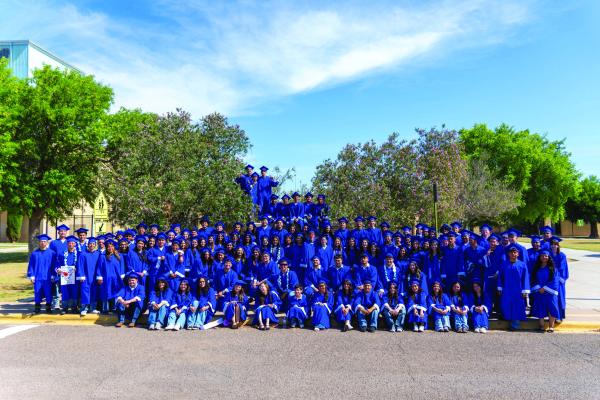 THE FIRST PHOTO TOGETHER IN CAP AND GOWNS - The Fort Stockton High School Class of 2026 gathered in front of FSHS following the Senior Walkthrough for their first official class photo as graduating seniors. A special moment that marks the middle of graduation week and the final chapter of their high school journey. Photo courtesy of Tumbleweed+