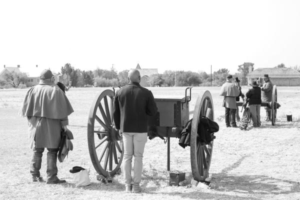 Modern military men from neighboring active forts visited the historic Fort of Fort Stockton on Tuesday. Reenactors guided them through the Fort and museum, giving a deep dive into the history and methods of the old west’s military and calvary. The officers were even able to don the coats and assist in firing the Fort’s cannon. Photo by Joh Covington