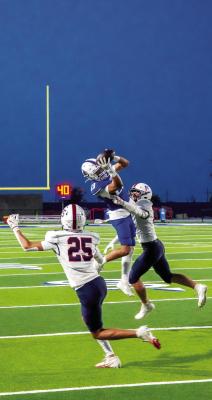 Footballers — Fort Stockton’s Nikki Sotelo soars high to make a spectacular grab against the Liberty Patriots in last Friday night’s hard-fought battle at Panther Stadium. His highlight-reel catch was one of the few bright sparks for the Panthers in a tough matchup. Photo by Carlos Leyva, Tumbleweed+