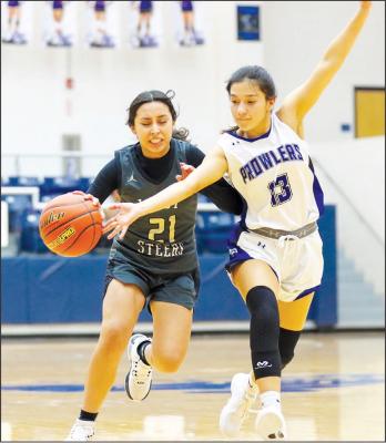 Addison Castro (13) fights off a Big Spring defender during Tuesday night's 51-41 Prowler win. Pioneer photo by Shawn Yorks