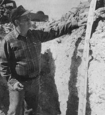 May 1999 - SOIL SURVEY MARKS CENTENNIAL - Jerry Rives of the Soil Survey’s Pecos office examines a soil profile in Terrell County. A monolith of that profile was selected for the centennial celebration. (Pioneer Photo)