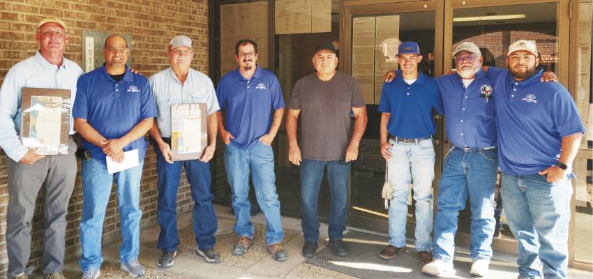 Jeff Williams and Patrick Blisnak, with personnel of City Waterworks, who worked through the night to establish the connection, after Mayor Paul Casias gave a proclamation for their assistance and generosity during the water situation. Courtesy Photo: Pioneer