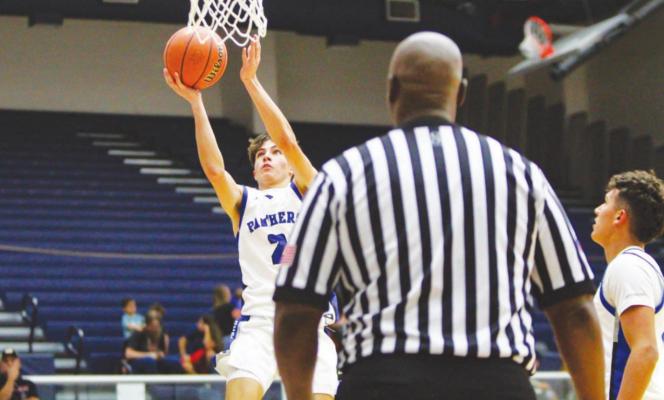 Fort Stockton’s Caleb Garcia attacks the basket during the Panthers home opener against Lamesa Nov. 30. Photo by Nathan Heuer