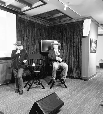 Tracy Hart and Kirby Warnock address the crowd at the Wittliff Collections before screening the documentary by Warnock, “Jimmie and Stevie Ray Vaughan, Brothers in Blues.”