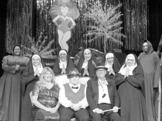 Cast members pose for photo opportunity during dress rehearsal.