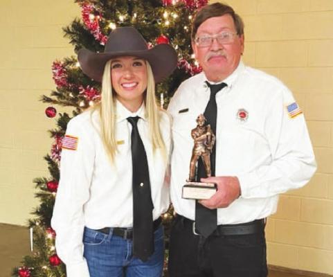 Charles Slater is pictured with fellow firefighter Stephanie Elmore