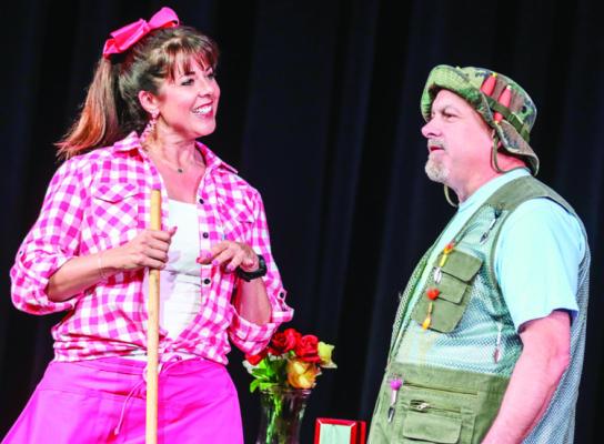 Tracy Alexander as Georgia Dean, left, and Robert Pfeiffer as Nash Sloggett perform a scene from the Fort Stockton Community Theatre production of “Honky Tonk Hissy Fit,” during rehearsal last week. Performances begin Friday, March 12 at the Nelson Street Theatre. Photo by Shawn Yorks