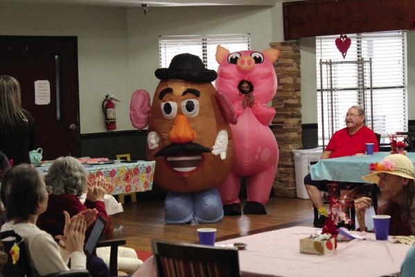 Mr. Potato Head and Miss Piggy watch their fellow entertainers take to runway.