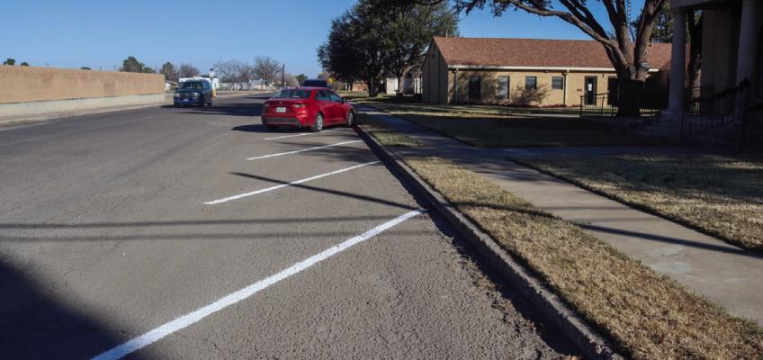 Traffic makes its way down the 200 block of North Oklahoma Street between the First Presbyterian Church and Fort Stockton Intermediate School on Dec. 20. New angled parking stripes can be seen in front the Presbyterian Church that will hopefully alleviate parking issues during school days and church events. Photo by Shawn Yorks