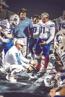 Fort Stockton ISD Athletic Director and Head Football Coach DJ Howell speaks with Panther players and coaches during a Fort Stockton football game this past season. Howell announced his resignation this week after one year leading Panther and Prowler athletics. Photo by Ayden Chavez, Tumbleweed+