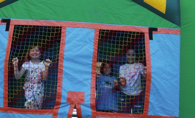 The First Presbyterian Church hosted a church-wide picnic last Wednesday, feeding community members and offering the good fun of a bouncy house for the kids. Photo by Kerry Waldrip