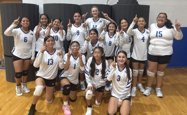 The Fort Stockton Middle School eighth-grade White Prowlers celebrate their first-place finish at the Fort Stockton tournament Saturday. The Prowlers defeated Presidio, Pecos and Monahans, rallying from an opening-set loss against Monahans to win the championship in three sets. Courtesy photo