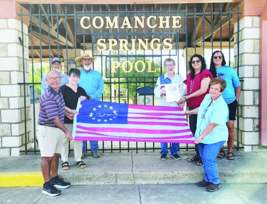 On Monday, the Pecos County Historical Commission presented the 250th Flag to Angela Lujan and assistants. The short ceremony took place in front of the Comanche Springs Entrance Gate on Spring Drive. Photo by Joh Covington