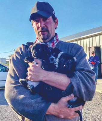 Fort Stockton animal control officer Dennis Gross helped load three puppies in a transport that will give the animals a new lease in life in the northern part of the country. Gross did so on last week at the animal shelter in Fort Stockton. The shelter along with CPAR help save over 1,000 animals per year in the Fort Stockton area. Courtesy Photo