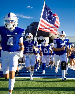 The Fort Stockton Panthers charge out of the tunnel and onto the field before Friday night’s matchup against Idalou at Panther Stadium. Photo by Isabella Gutierrez, Tumbleweed+