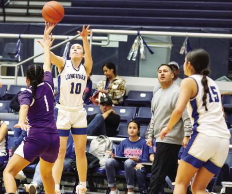 Buena Vista senior Destiny Jurado (10) launches a 3-pointer over Marfa senior post Liani Salcido (1), Monday afternoon during a Class 1A bi-district playoff game in Fort Stockton. Jurado scored 23 points to lead the Longhorns in a 63-28 win over the Shorthorns. Buena Vista (11-11 overall) will play Mertzon Irion County (23-8) Friday at 6 p.m. Photos by Shawn Yorks