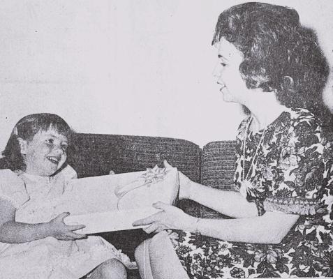 MAY 1968- HAPPY MOTHER’S DAY- Karla Chadwell, age three, presents her mother, Mrs. Bill Chadwell, with Mother’s Day gift, joining others in Fort Stockton and around the world in honoring the feminine part of the household today (Pioneer Photo)