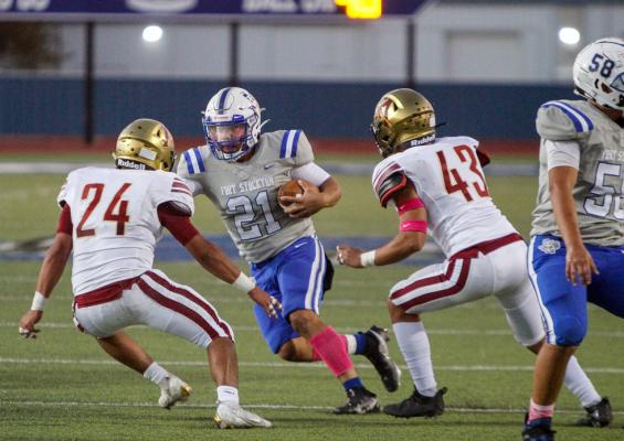 Fort Stockton senior quarterback Dominic Aguilar runs around a pair of El Dorado defends during the Panthers homecoming game on Oct. 8. Aguilar could be relied upon a great deal on Friday as the health of starting running back Corbin Luna may prevent the sophomore standout from playing. 