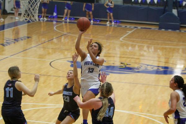 Fort Stockton’s Alyana Dominguez (13) attacks the basket during Tuesday’s contest against Greenwood. The senior led the Prowlers in scoring in both of their games over the last week. Photo by Nathan Heuer