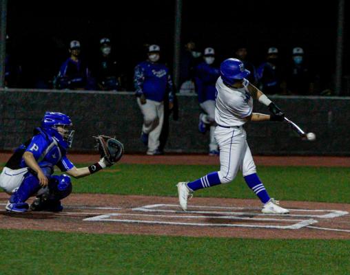 Fort Stockton’s Diego Renteria makes contact with a pitch for a single on Tuesday in the Panthers home-opener against Presidio. 