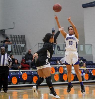 Fort Stockton’s Alyana Dominguez (13) converts one of her three made 3-pointers during Tuesday’s contest against Andrews. Photo by Nathan Heuer