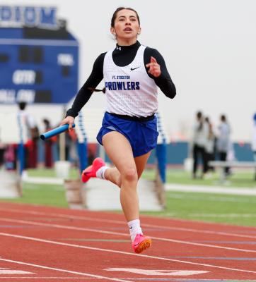 Rosa Hernandez finishes the final leg of the 400-meter relay on Saturday.