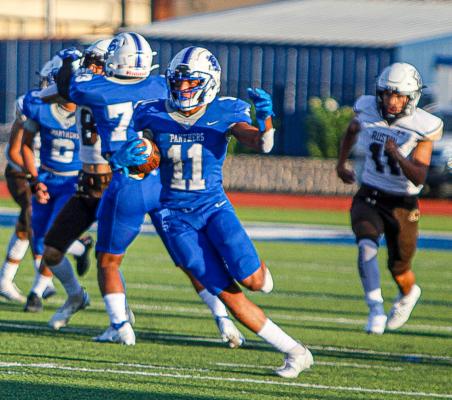Isaiah Garcia (11) breaks loose for a kick return touchdown against El Paso Austin on Aug. 26, 2022. Garcia tallied 503 return yards during the 2022 season. Photo by Nathan Heuer