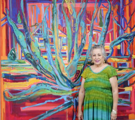 Fort Stockton native and acclaimed artist Carolina G. Flores stands in front of her “Maguey” oil painting that will be on display at the “COLOR” art show this Friday. The show will be hosted at the 209 W. 1st St. gallery adjacent to Joe’s Place. Photo by Jeremy Gonzalez