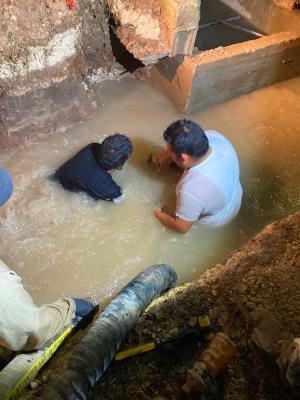 City employees Gabriel "Batman" Ureste and Jason Bernal were waist-deep in water while battling a leak of nearly two-million gallons. The overnight efforts included the labor of the city's water and waste water departments with the help of the Pecos County Water Improvement District No.1. Courtesy Photo