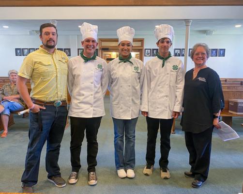 4-H students that competed in the state meet included, James Garrison of Fort Stockton, second from left; Mikki Mandujano of Coyanosa, middle; Bryon Garrison of Fort Stockton, second from right. Also pictured is Agricultural and Natural Resources 4-H Agent Payton Keifer, left, and Karan Heffelfinger, right. The students are pictured at Monday’s Commissioner Court meeting at the Pecos County Courthouse. Photo by Nathan Heuer