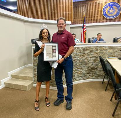 2022 Miss Fort Stockton Ysabella Sanchez and Fort Stockton Mayor Chris Alexander pose for a photo with the proclamation recognizing Ysabella Sanchez for her accomplishments and wishing her the best moving forward with her future endeavors. Photo by Nathan Heuer