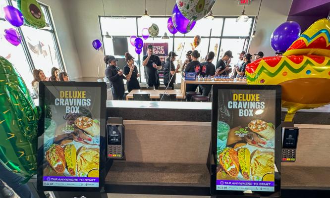 Digital order screens at Taco Bell.