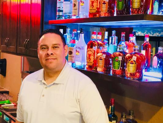 Joe Espino stands behind the sleek new bar at Joe’s Place located at 216 W.1st St. The building has been revived to satisfy the historic nostalgia and future night scene of downtown Fort Stockton. Photo by Jeremy Gonzalez