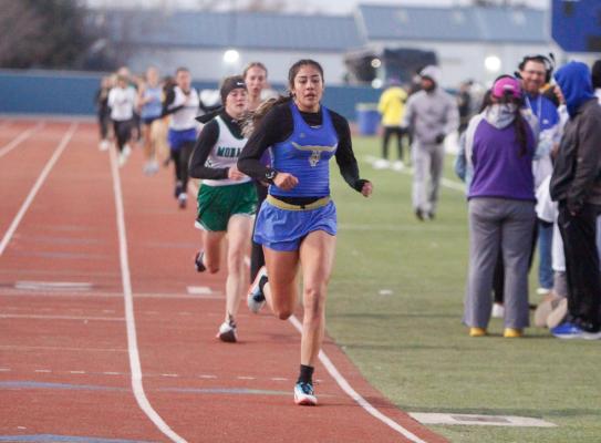 Mariana Sanchez, middle, compete in the 1,600 at the Comanche Relays on Feb. 26 at Fort Stockton High School. Sanchez’s time at state was 26 faster than the time she clocked at the relays this past February. Photo by Nathan Heuer