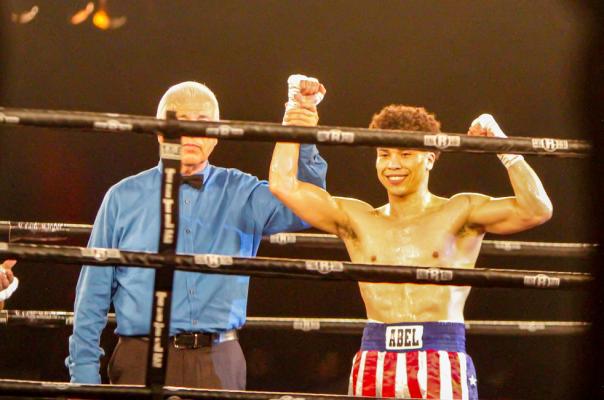 Abel Mendoza gets his hand raised after a victory against Israel Rojas at Warriors on the Rez boxing event at the Inn of the Mountain Gods in Mescalero, New Mexico on July 31, 2021. Photo by Nathan Heuer