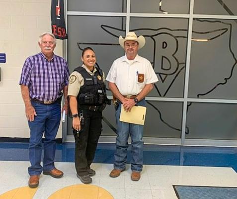 Pecos County Sheriff’s Office Deputy C. Moore, middle, will be the Buena Vista ISD SRO for the 2022-2023 school year. From left to right: Pecos County Judge Joe Shuster, Moore, Pecos County Sheriff TJ Perkins. Courtesy Photo