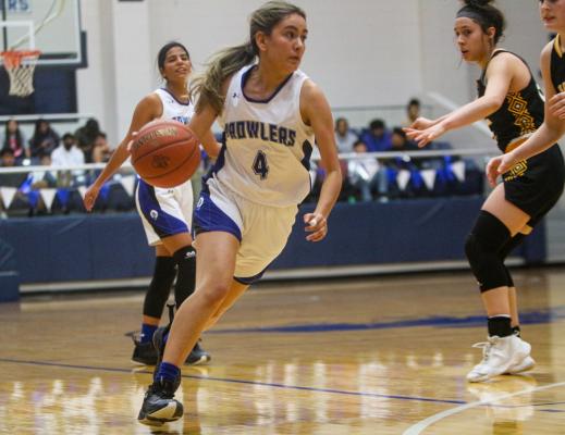 Fort Stockton guard Ivanna Ortiz (4) drives to the basket in the second half of Tuesday’s game at the Special Events Center. Ortiz finished the contest with two points. Photo by Nathan Heuer