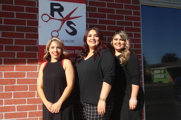 Excitement is in the air for Cynthia Soliz, Lydia Rodriguez and Angela Lopez. The Red Shears Hair Studio team celebrated relocating the business to 906 W Dickinson Blvd, a larger space that will welcome more clients. Photo by Megan Wehring
