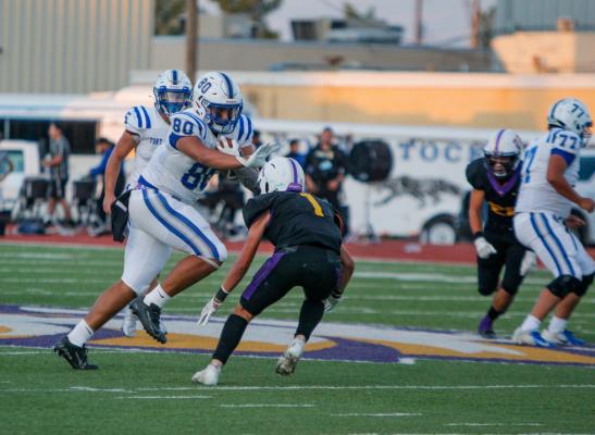 Panthers tight end Cruz Rojas stiff arms Pecos’ Jonathan Sandoval after a reception in the first half of Friday’s game. Rojas had two receptions for 19 yards in the win. 