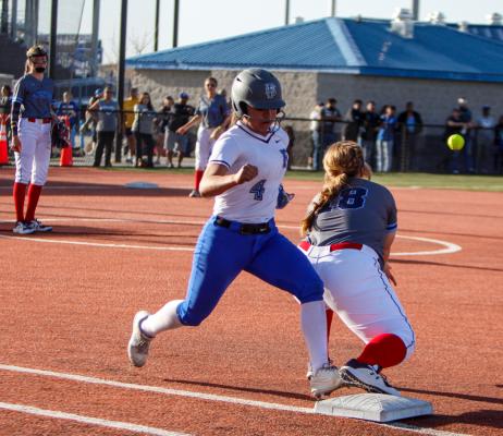 Fort Stockton’s Yadira Hernandez, left, outruns a throw and is safe at first base during Tuesday’s game against Greenwood. 