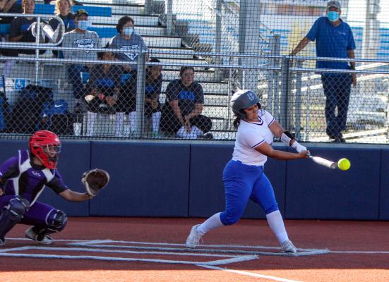 Fort Stockton’s Shelby Murphy makes contact with a pitch in the third inning of Tuesday’s game against Pecos at home. 