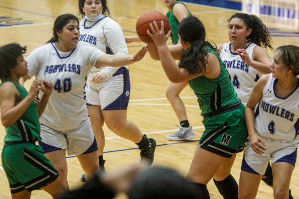Adree Bueno (40), Sophie Hernandez, middle, and Ivanna Ortiz (4) surround a Monahans ballhandler during Tuesday's game on Jan. 25 at the Special Events Center.