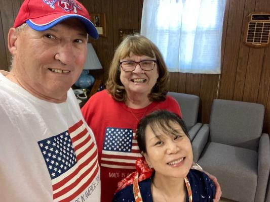 Senior Citizen board members Kirby and Diann Warnock pose with director Maria Gilbert at the Labor Day Potluck. Courtesy Photo